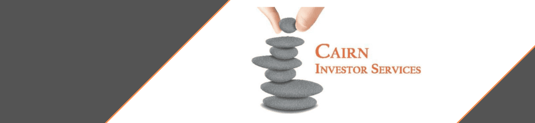 A hand placing the final stone on a balanced stack of pebbles alongside the text 